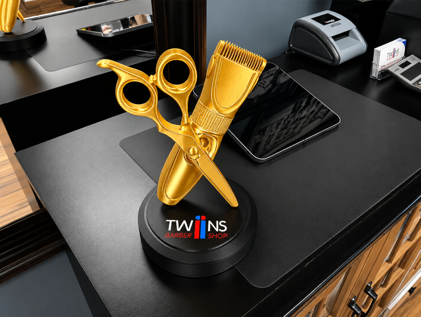 Gold scissors and clipper award display with Twins Barber Shop branding