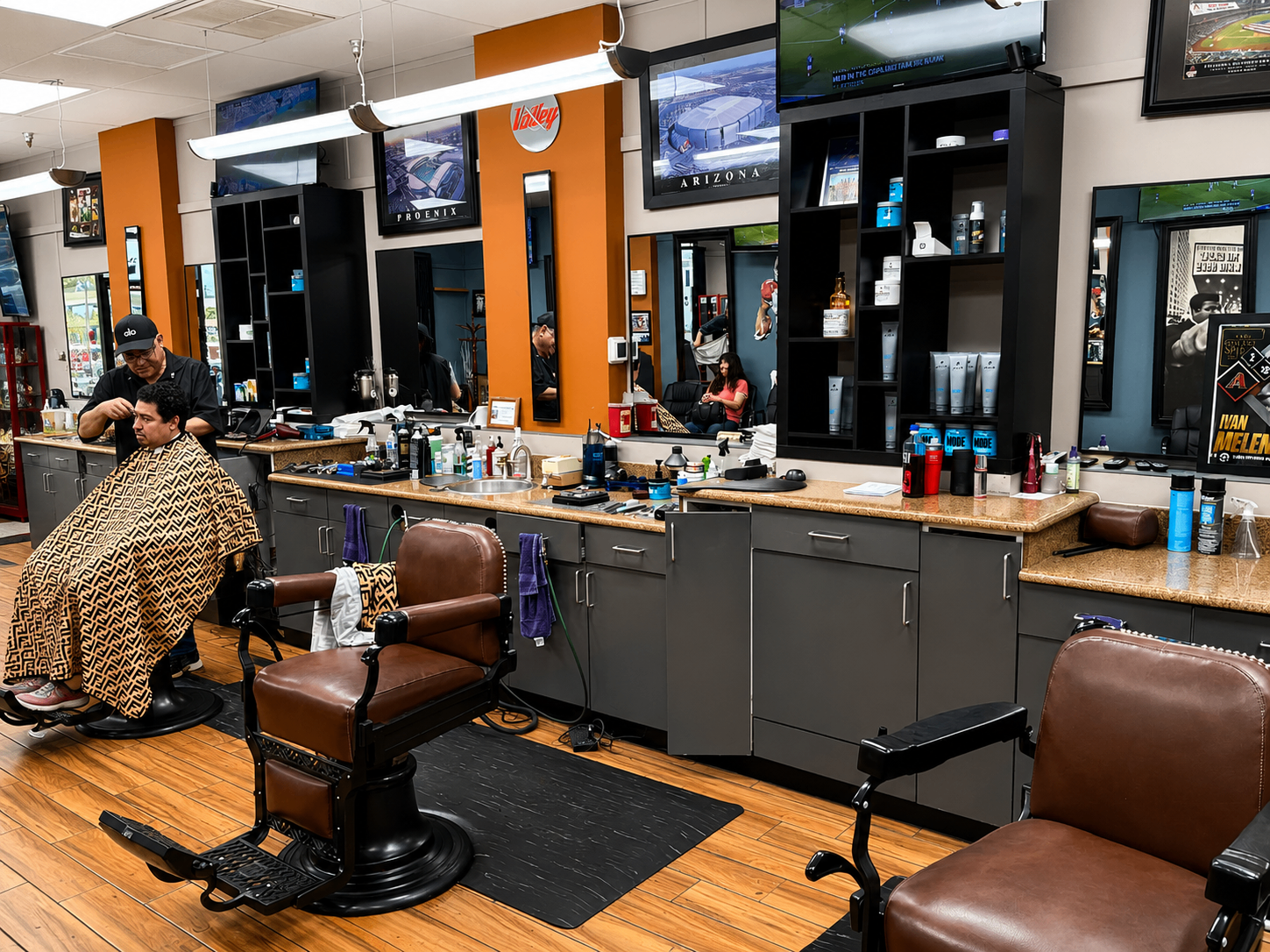 Live haircut in progress inside Twins Barber Shop with barber chairs and mirrors