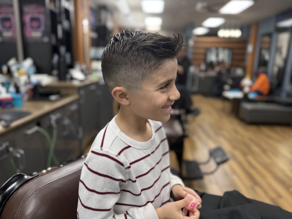 Kids fade haircut with textured top at Twins Barber Shop Phoenix