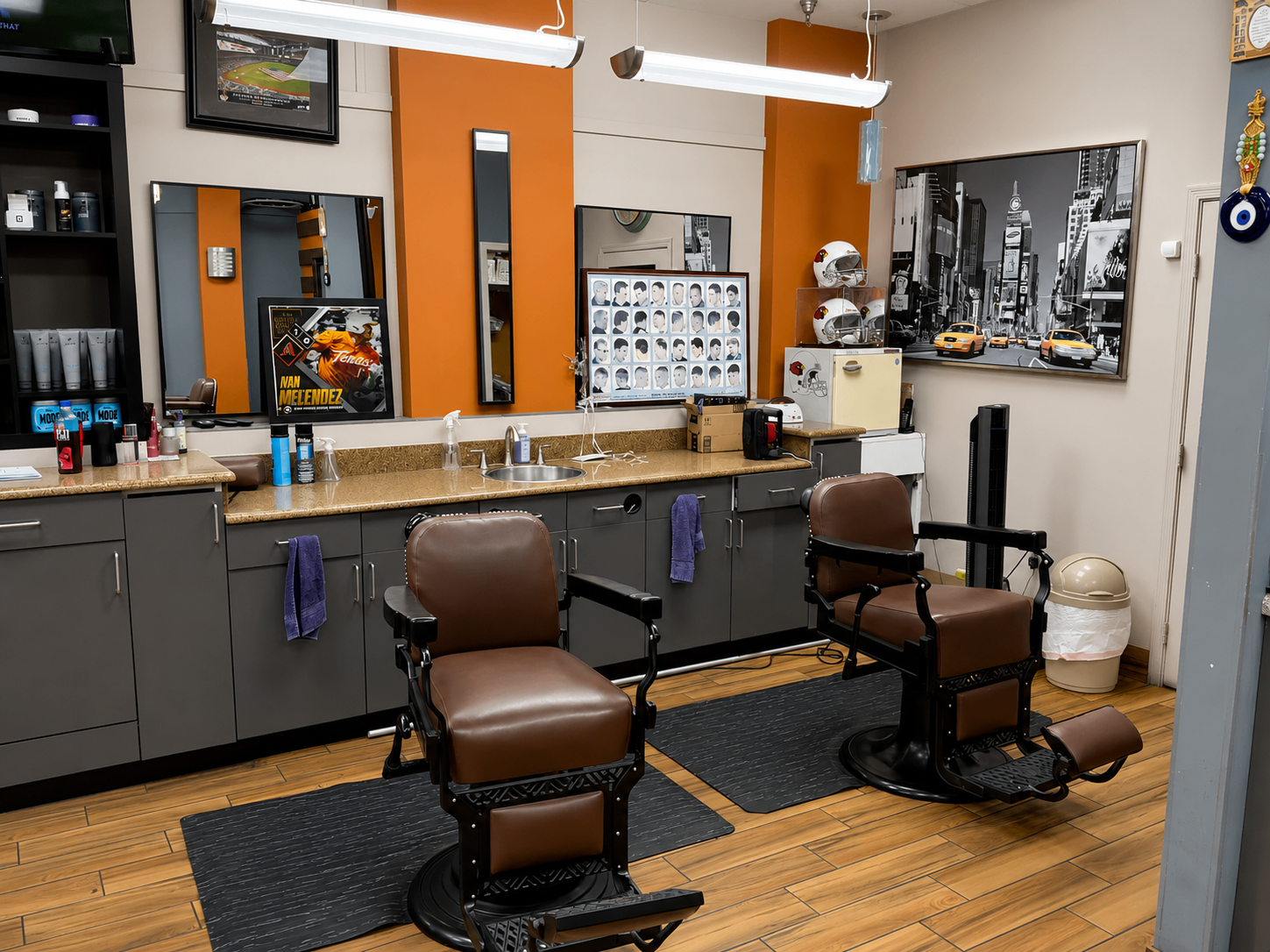 Wide view of barber chairs, mirrors and styling stations inside Twins Barber Shop