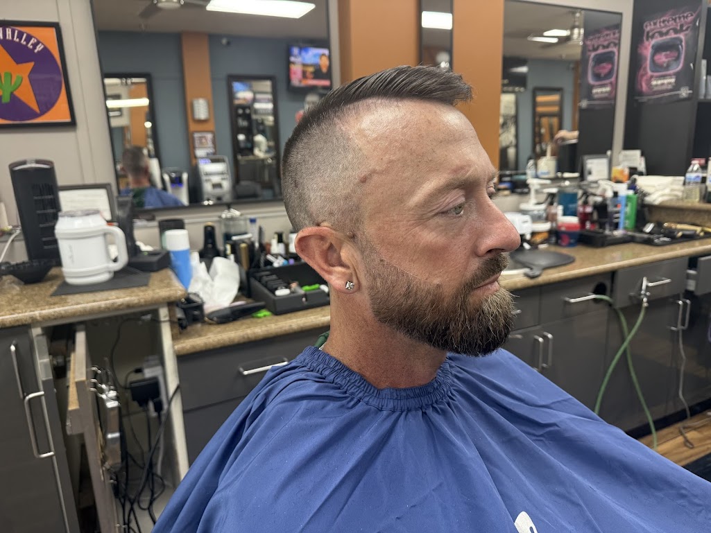 High and tight pompadour fade with beard detail at Twins Barber Shop