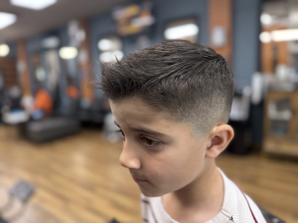 Kids brushed up haircut with mid skin fade at Twins Barber Shop Phoenix