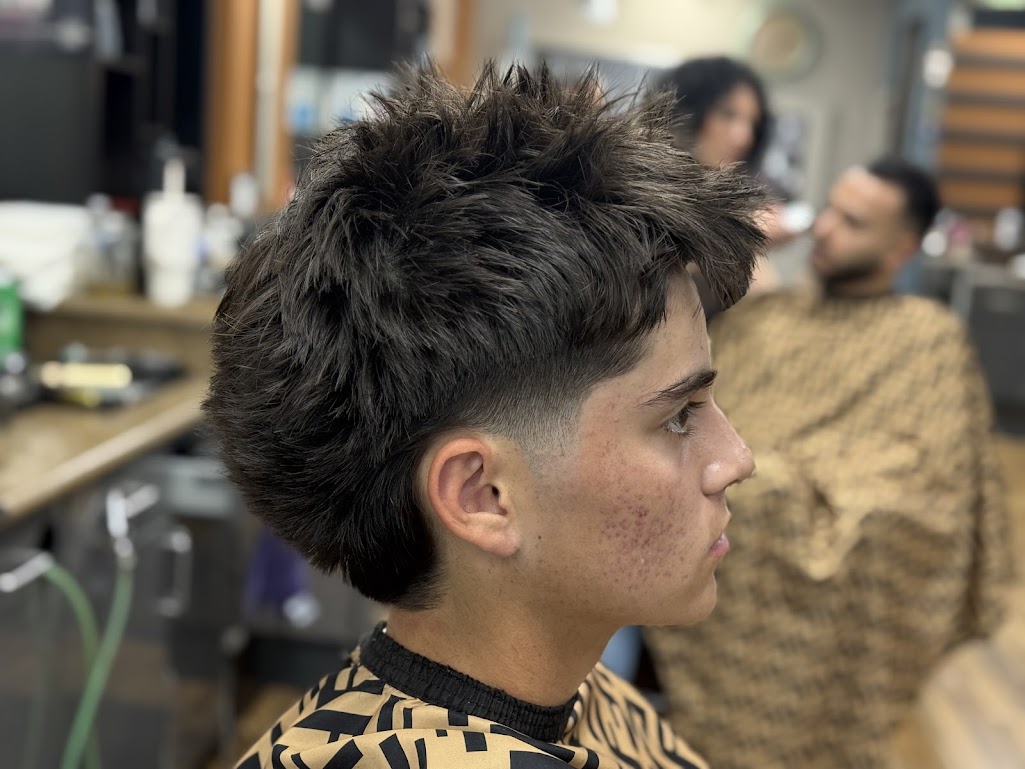 Spiky textured crop with low taper fade at Twins Barber Shop